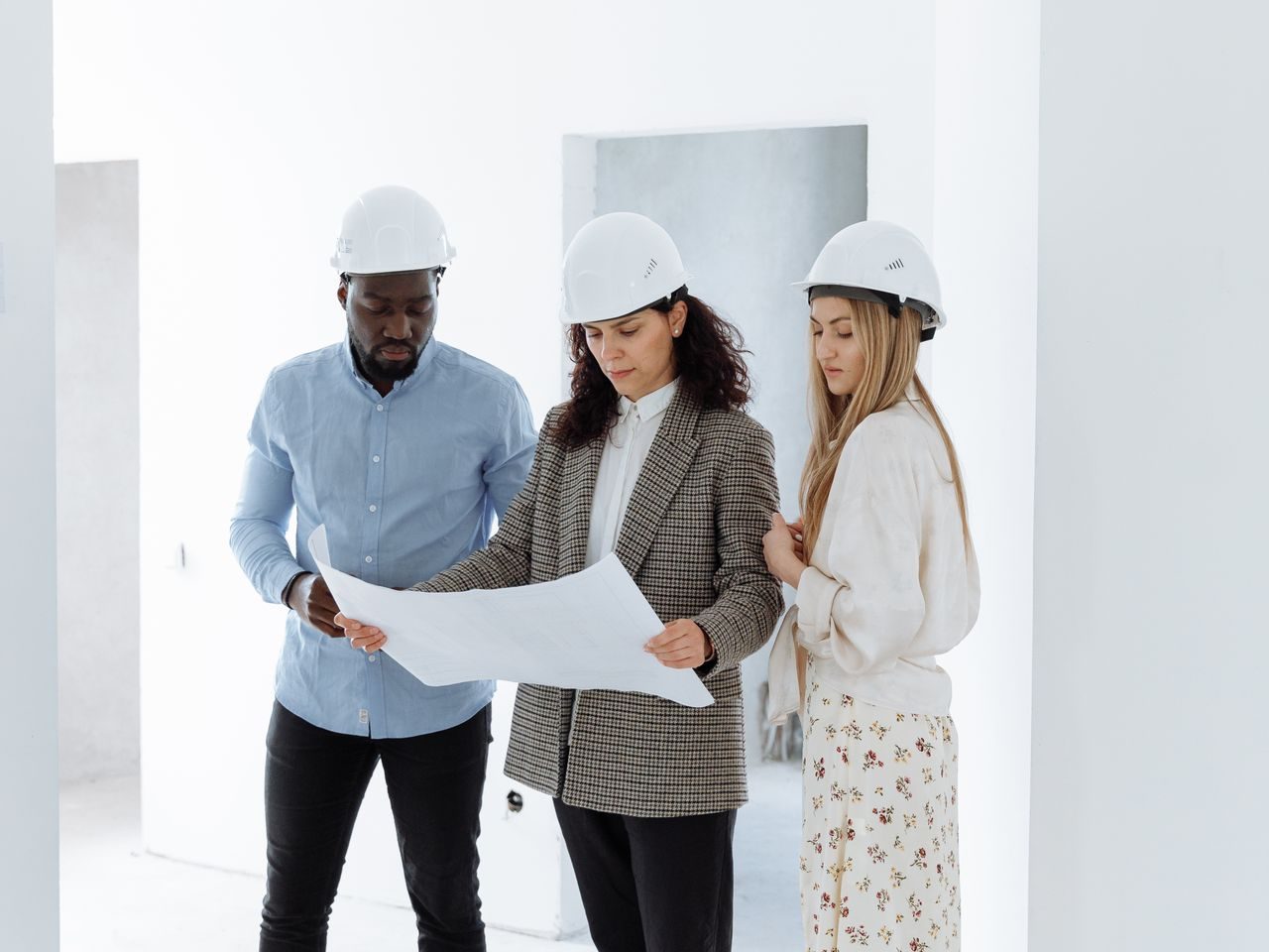 A contractor and business mentors meeting with a young apprentice